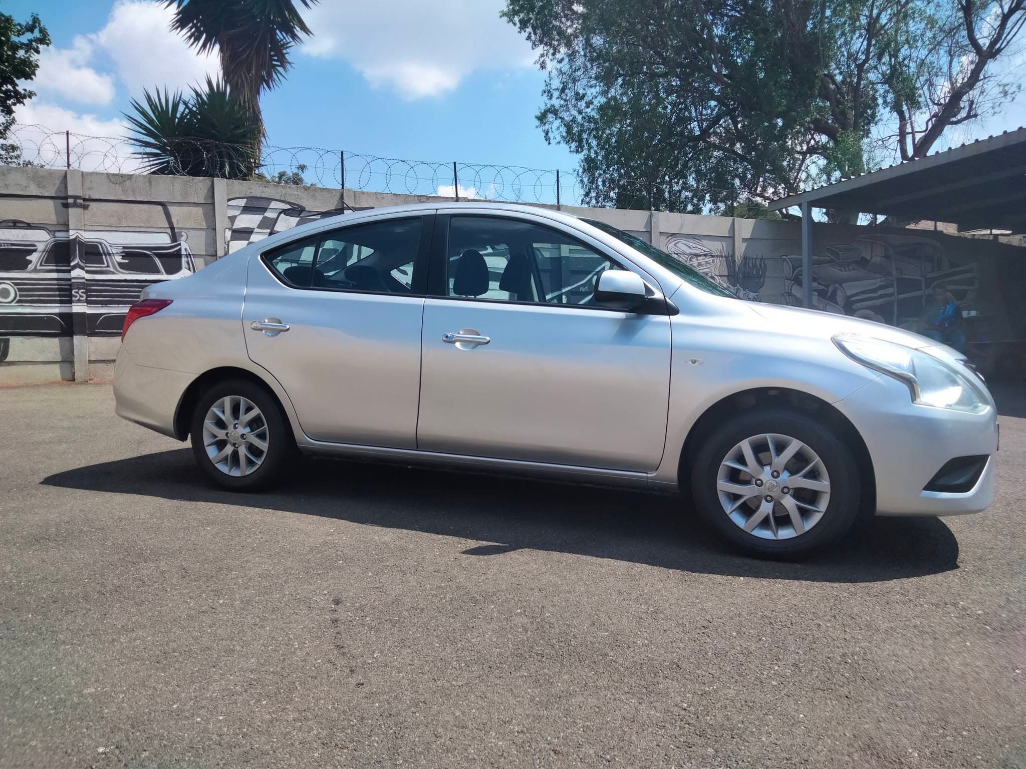 2015 Nissan Almera 1.5 sedan in silver, used car for sale in Krugersdorp (photo 1 of 12)